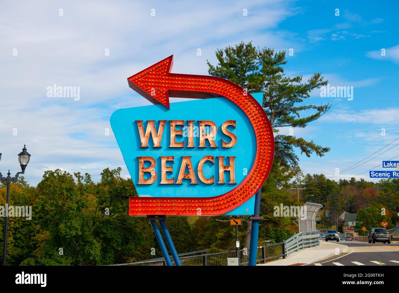 Entrance sign of Weirs Beach with neon lights in village of Weirs Beach