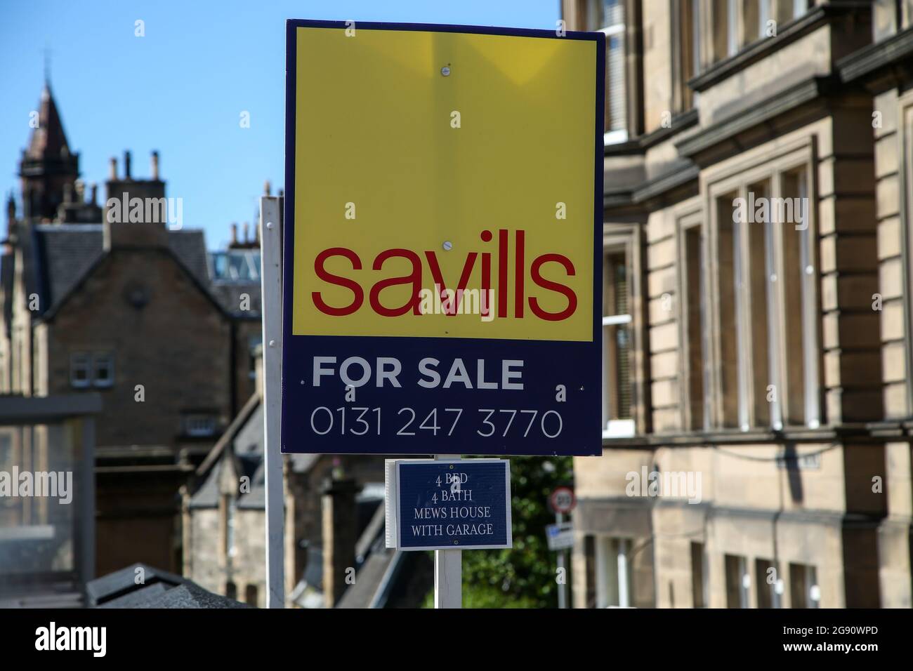 A ‘For Sale’ Savills estate agent board sign outside properties Stock