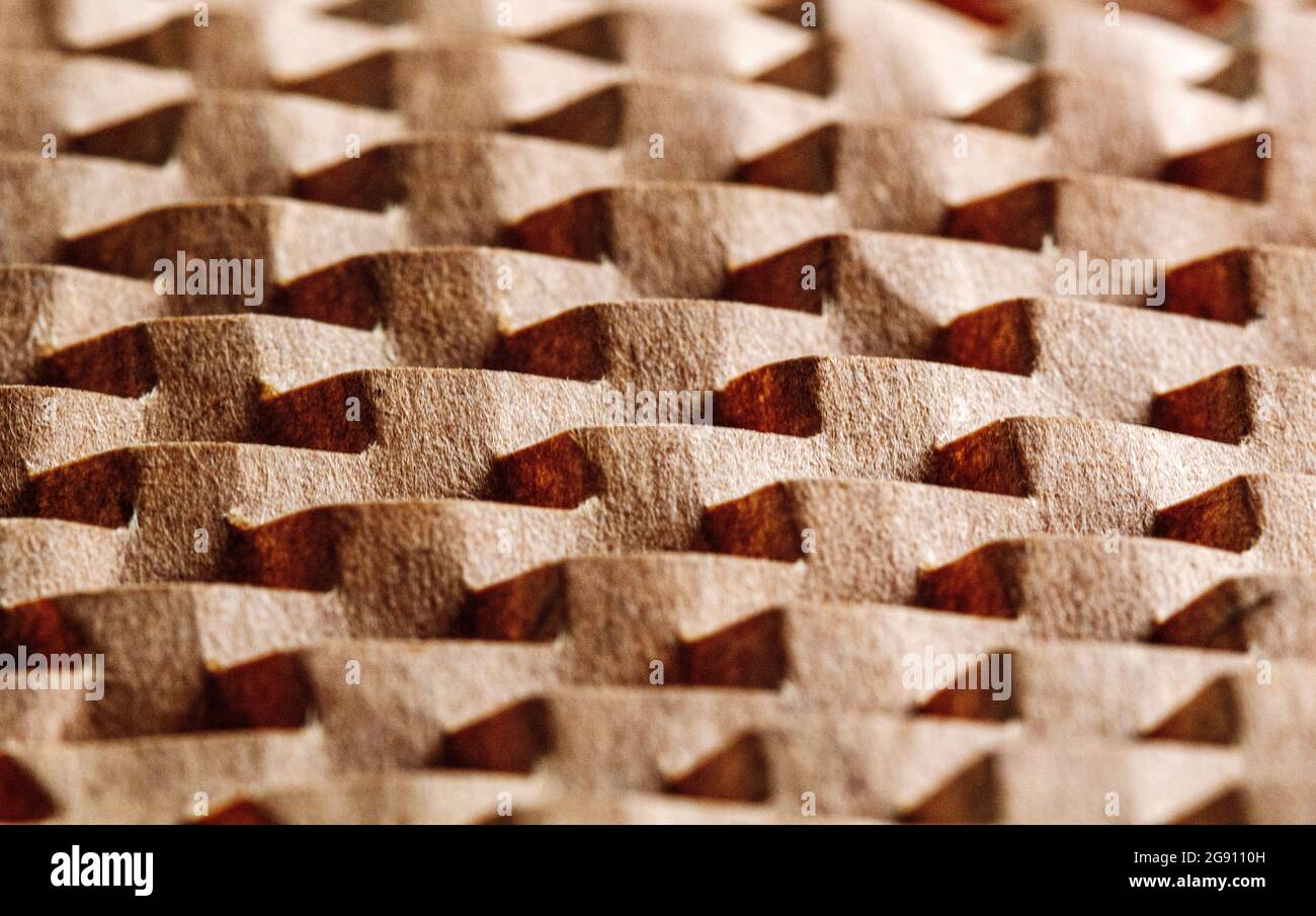 A macro shot of a piece of brown packing paper becomes a geometric design. Stock Photo
