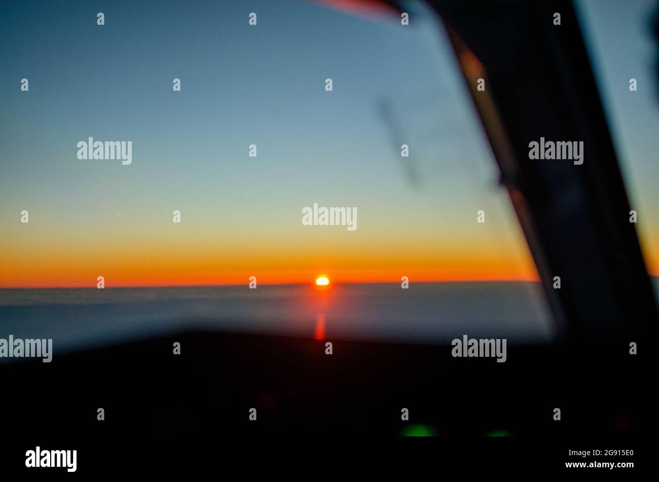 sunrise from the cockpit of an airline plane Stock Photo
