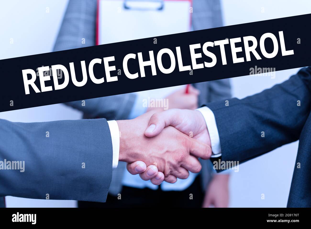 Sign displaying Reduce Cholesterol. Word for lessen the intake of saturated fats in the diet Two Professional Well-Dressed Corporate Businessmen Stock Photo