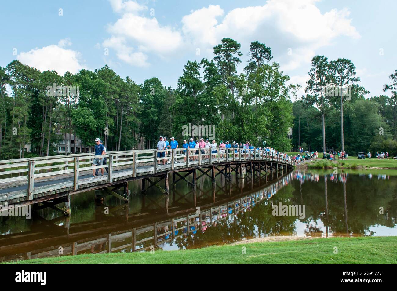 Pinehurst, North Carolina, USA. 23rd July, 2021. The gallery makes their way over the bridge on the 14th hole during the Semifinal at the 73rd U.S. Junior Amateur, July 23, 2021, at The Country Club of North CarolinaÃs Dogwood Course in the Village of Pinehurst, N.C. this yearÃs tournament saw the largest field ever with 264 players beginning stroke play on July 19. (Credit Image: © Timothy L. Hale/ZUMA Press Wire) Stock Photo