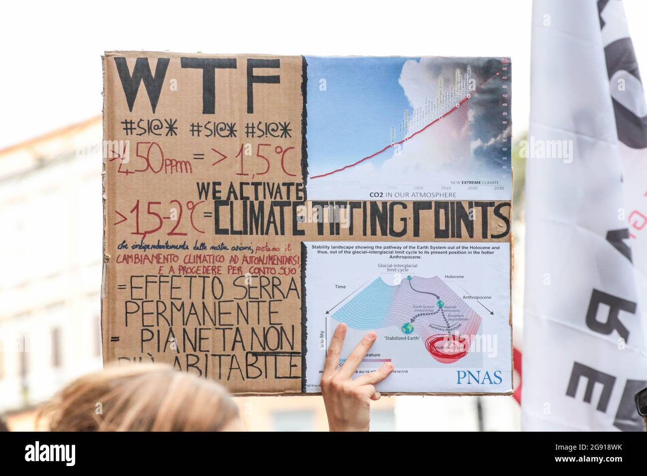 London, England, UK. 22nd July, 2021. A protestor shows a billboard explaining the essential data demonstrating that the planet is getting to the tipping points of the Climate Emergency leading to human extinction in Via Roma. While the G20 Ministerial Meeting on Environment, Climate and Energy continues at the Royal Palace of Naples, associations, movements and charities meet on the streets for the ''Bees Against G20'' march. (Credit Image: © Sabrina MerollaZUMA Wire) Stock Photo