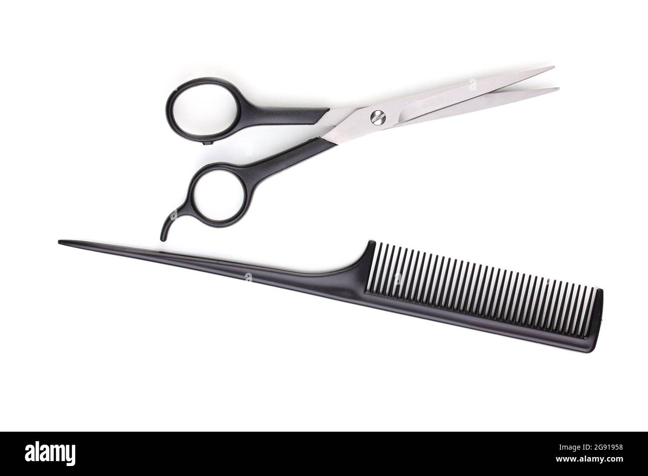 Hair cutting shears and comb isolated on white Stock Photo Alamy