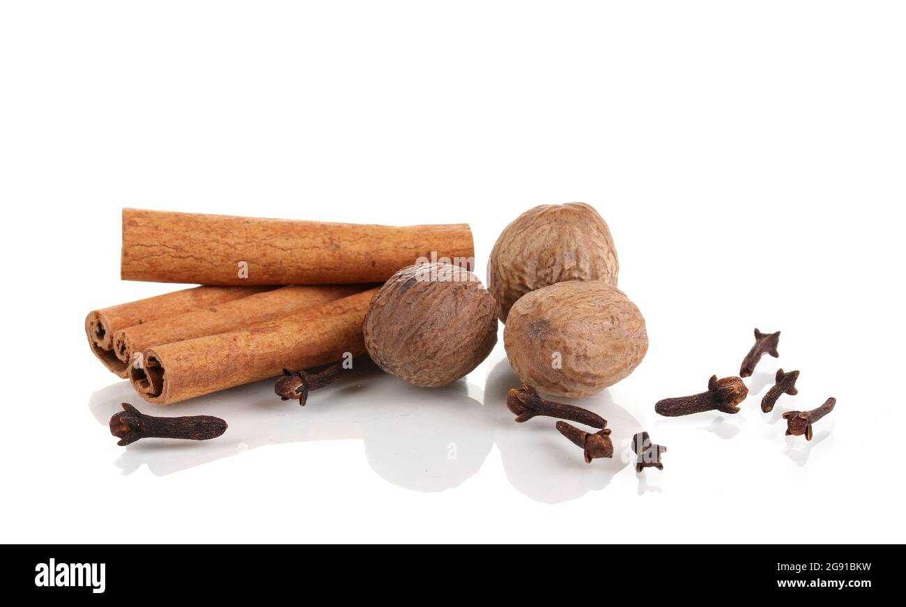 Cinnamon,nutmegs and carnation isolated on white Stock Photo Alamy