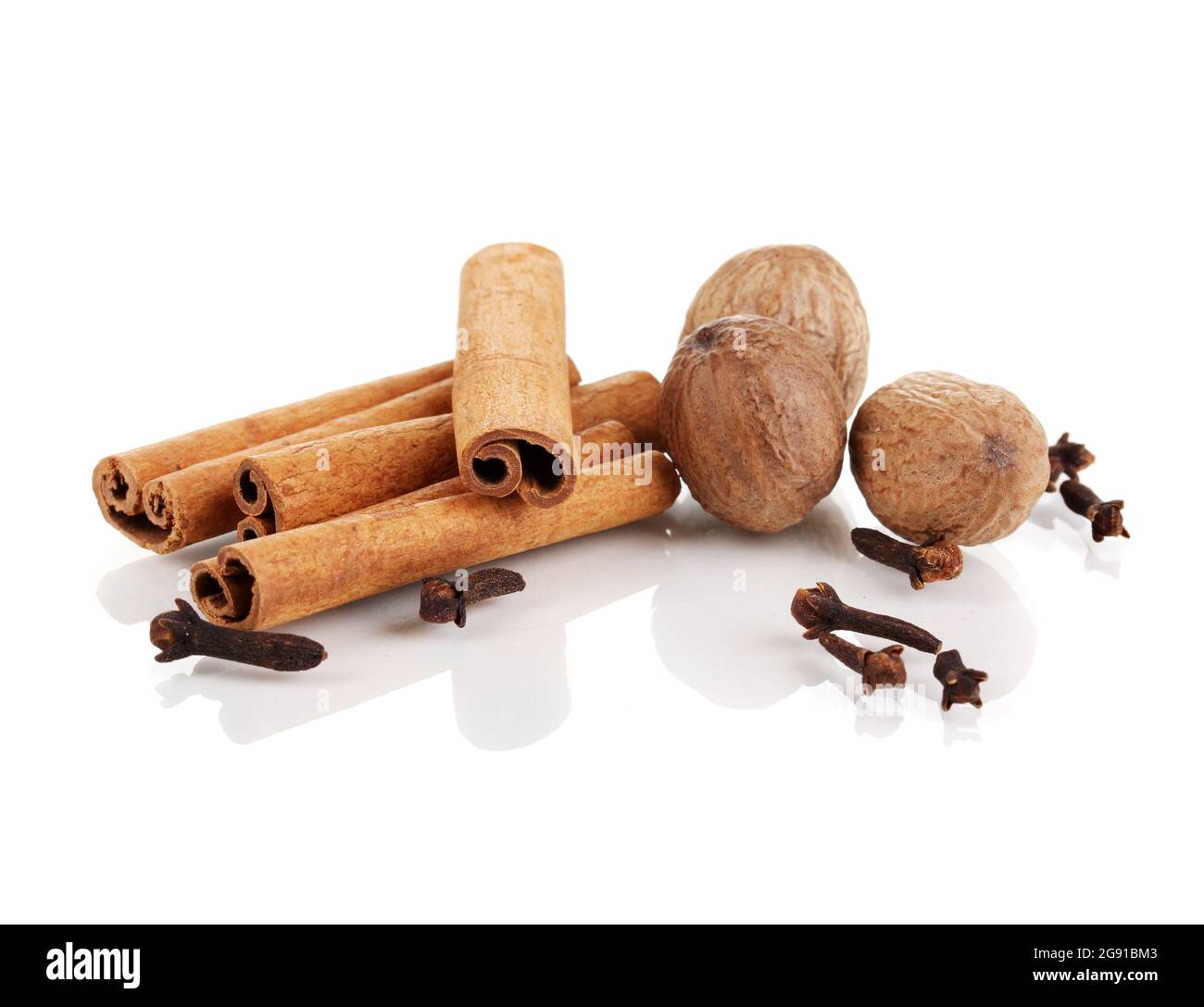 Cinnamon,nutmegs and carnation isolated on white Stock Photo Alamy