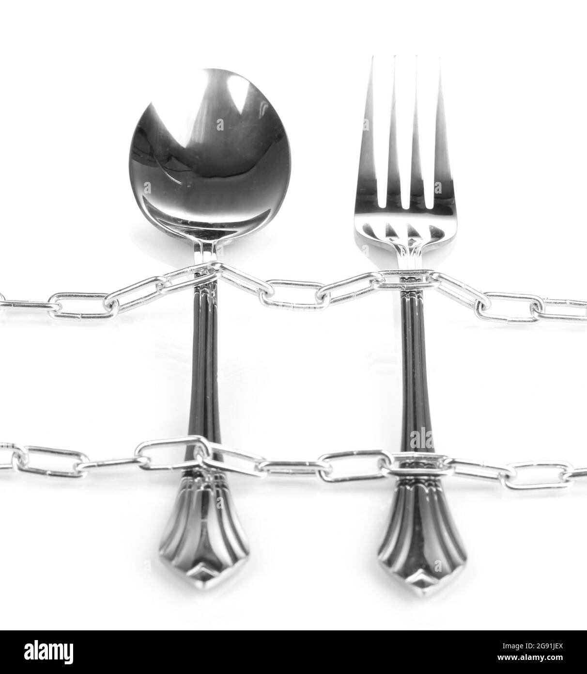 Fork and spoon with chain isolated on white Stock Photo Alamy