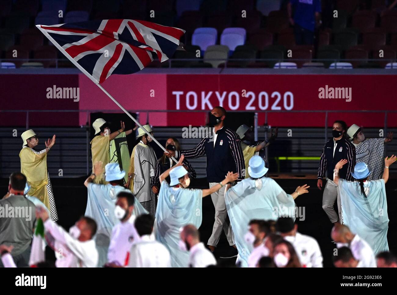 Tokyo, Japan. 23rd July, 2021. Opening ceremony. Olympic stadium. 10-1 Kasumigaokamachi. Shinjuku-ku. Tokyo. The Great Britain and Northern Ireland team arrive into the stadium, lead by co-flagbearers Hannah Mills (Sailing) and Mohamed Sbihi (Rowing). ]Credit Garry Bowden/Sport in Pictures/Alamy live news Credit: Sport In Pictures/Alamy Live News Stock Photo