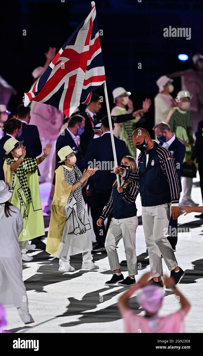 Tokyo, Japan. 23rd July, 2021. Opening ceremony. Olympic stadium. 10-1 Kasumigaokamachi. Shinjuku-ku. Tokyo. The Great Britain and Northern Ireland team arrive into the stadium, lead by co-flagbearers Hannah Mills (Sailing) and Mohamed Sbihi (Rowing). ]Credit Garry Bowden/Sport in Pictures/Alamy live news Credit: Sport In Pictures/Alamy Live News Stock Photo