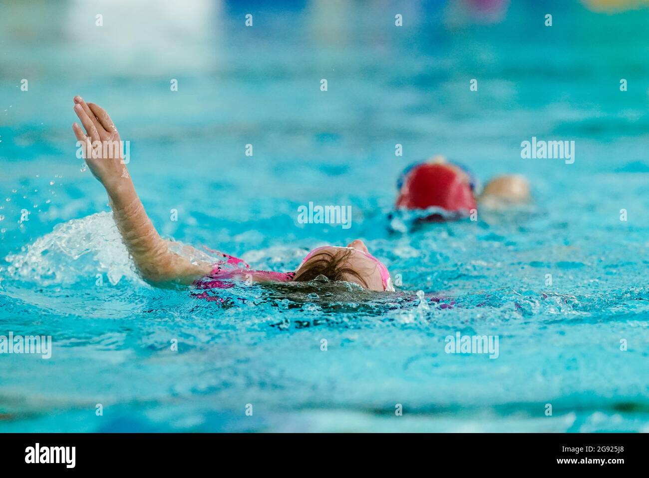 Heidelberg, Germany. 23rd July, 2021. Antonia learns backstroke in the swimming pool of the