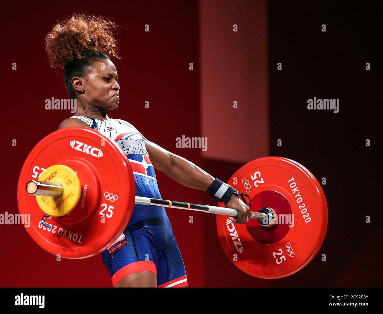 Tokyo, Japan. 24th July, 2021. Beatriz Elizabeth Piron Candelario of the Dominican Republic competes during the women's 49kg weightlifting event of the Tokyo 2020 Olympic Games in Tokyo, Japan, July 24, 2021. Credit: Yang Lei/Xinhua/Alamy Live News Stock Photo