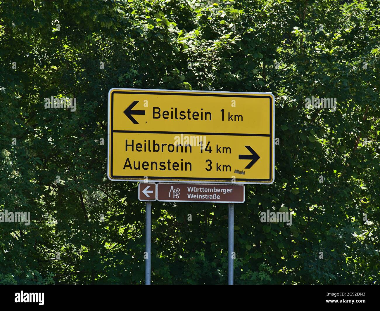 Directional sign with distances to Auenstein and city Heilbronn at junction of country road L1100, part of Württemberger Weinstraße, near Beilstein. Stock Photo