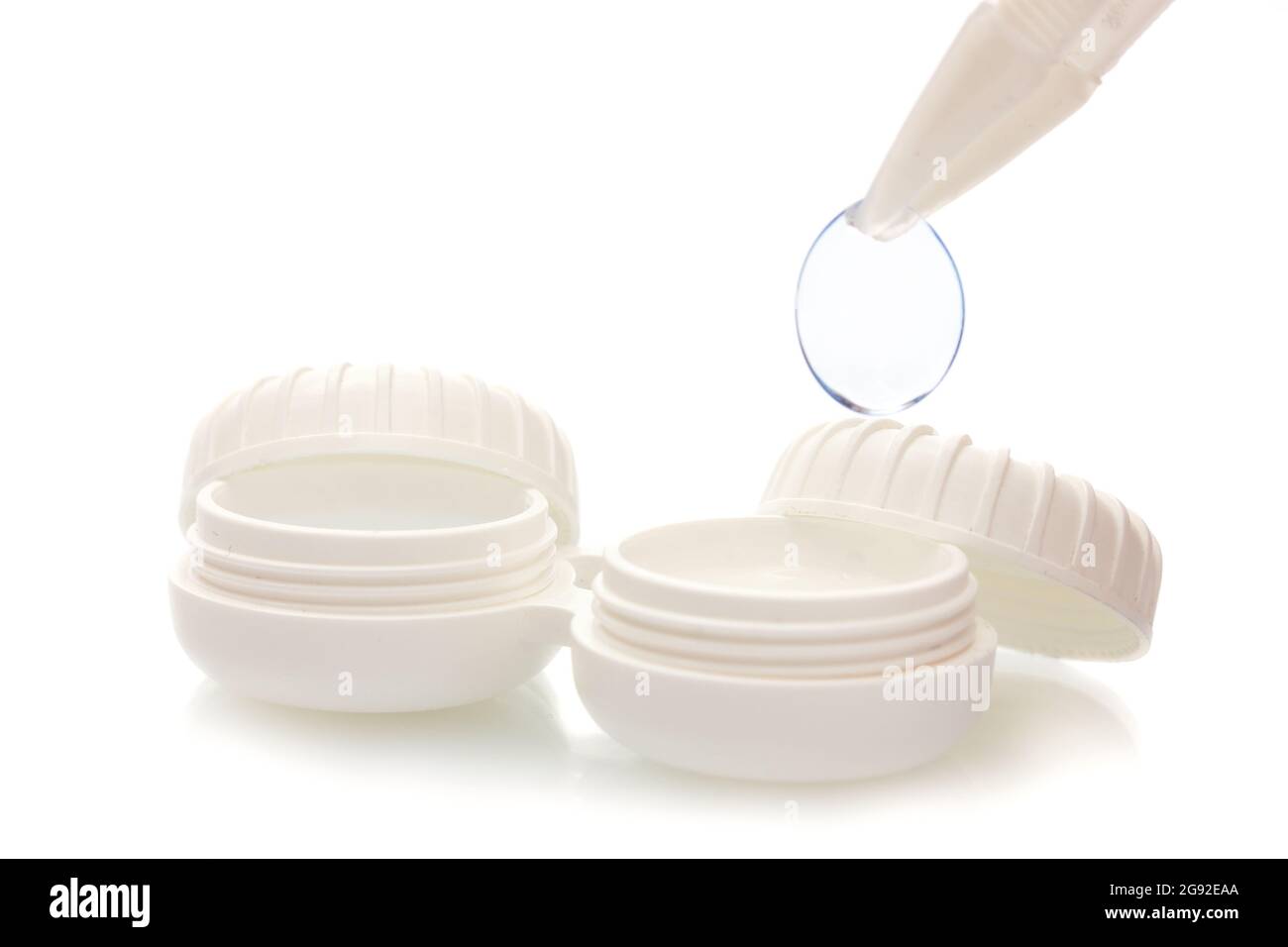 contact lenses in containers and tweezers isolated on white Stock Photo Alamy