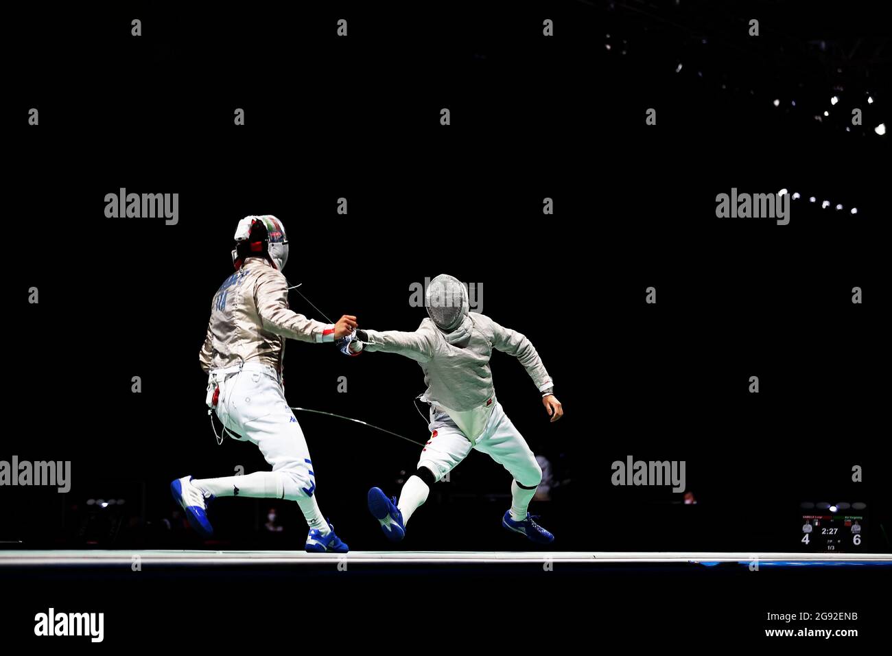 Tokyo, Japan. 24th July, 2021. China's Xu Yingming (R) competes with