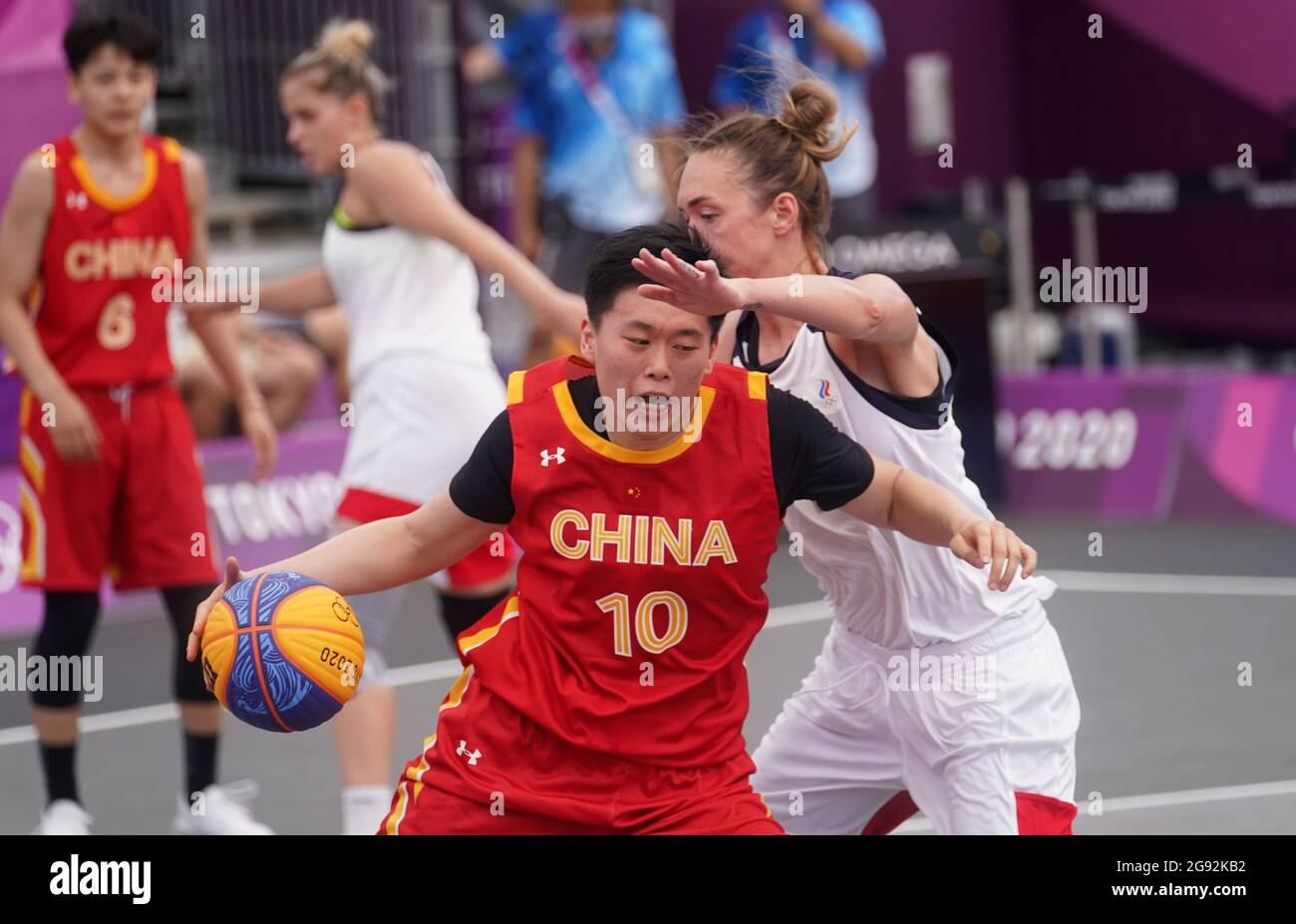 China's Zhiting Zhang (left) during the Women's 3x3 Basketball Preliminary Round at the Saitama Super Arena on the first day of the Tokyo 2020 Olympic Games in Japan. Picture date: Saturday July 24, 2021. Stock Photo