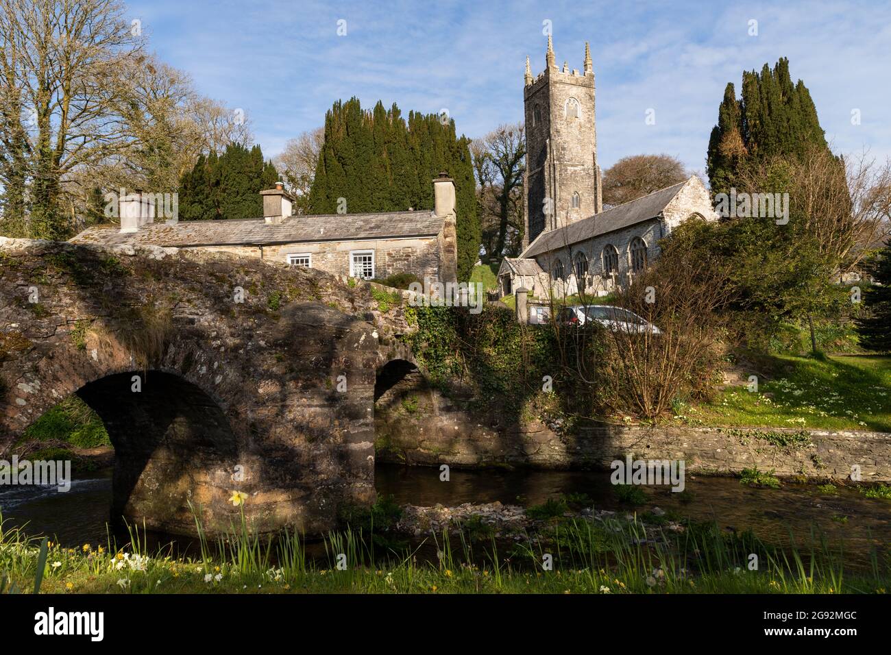 St Nonna's Church Altarnun, Cornwall overlooking river and old bridge Stock Photo