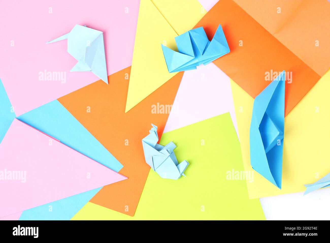blue origami on bright paper background Stock Photo - Alamy