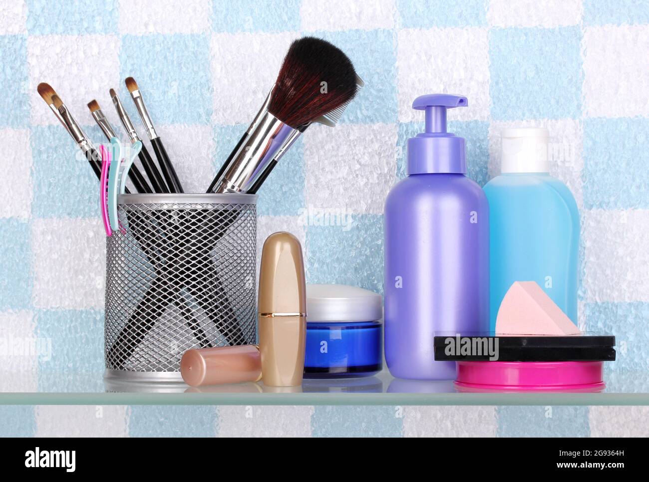 Shelf with cosmetics and toiletries in bathroom Stock Photo - Alamy