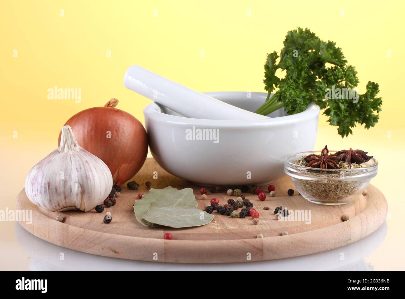 White mortar and pestle with spice on yellow background Stock Photo Alamy