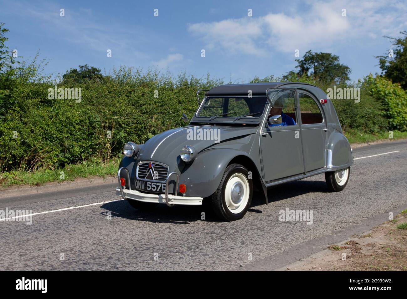 1963 60s sixties French grey Citroen 2CV 425cc petrol, left-hand drive vehicle en route to Capesthorne Hall classic July car show, Cheshire, UK Stock Photo