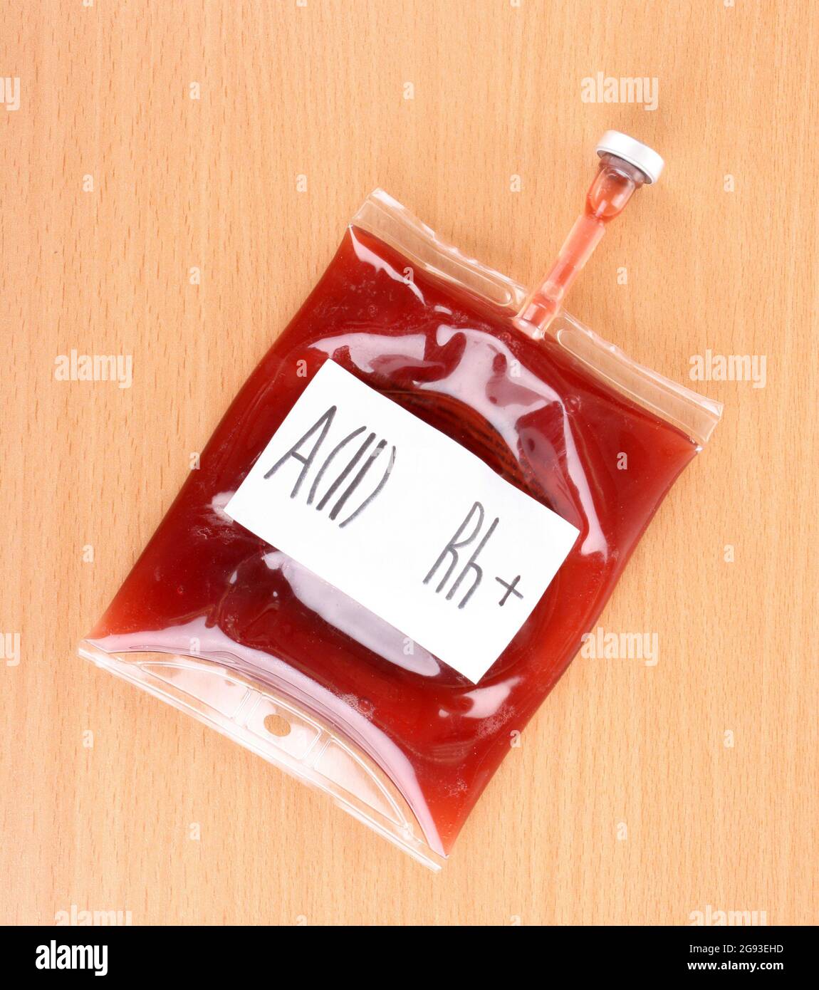 Bag of blood on wooden background Stock Photo - Alamy