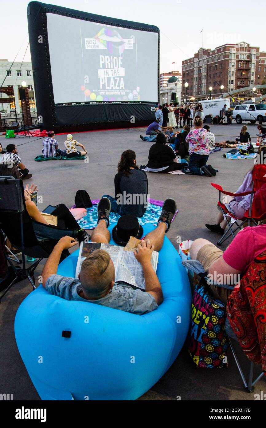 Reno, United States. 22nd July, 2021. Pride event attendees get comfortable as they wait for 'Rocky Horror Picture show' to start. The 'Rocky Horror Picture show' was part of the 'Pride in the Plaza' LGBTQ  event. Credit: SOPA Images Limited/Alamy Live News Stock Photo