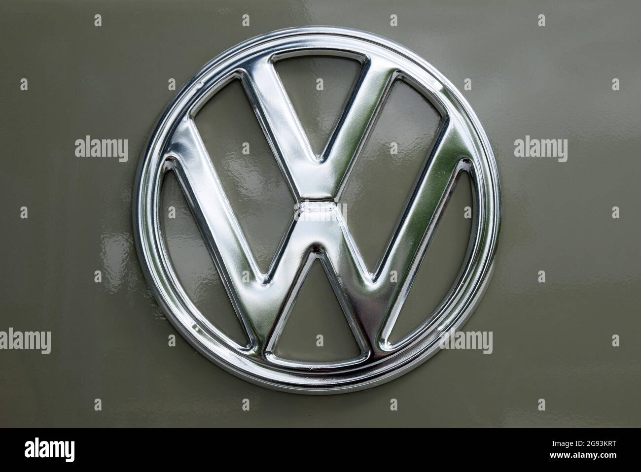 A polished emblem of the Volkswagen group on a gray car Stock Photo