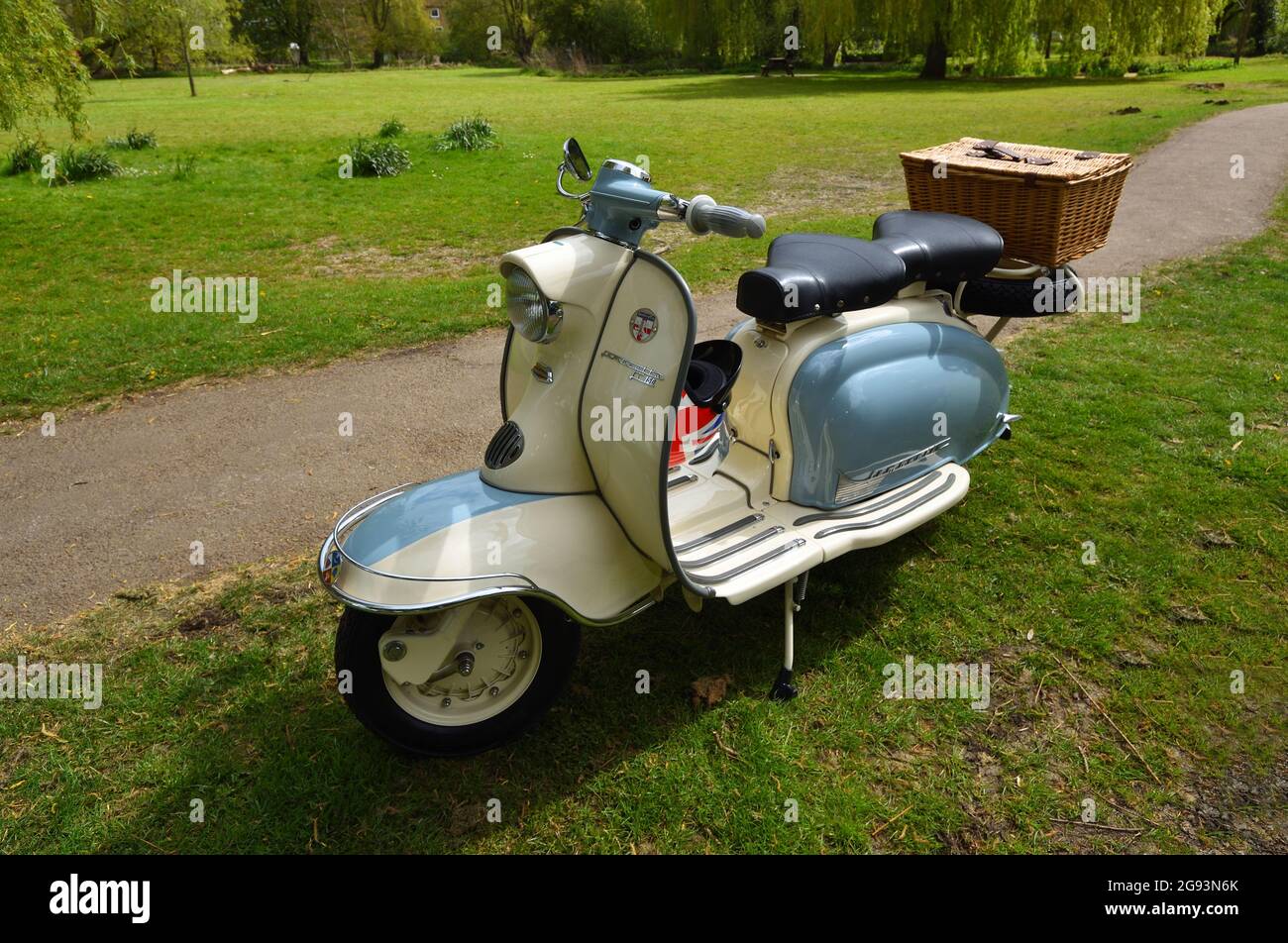 Blue and White Lambretta Motor Scooter with basket on the back Stock Photo  - Alamy