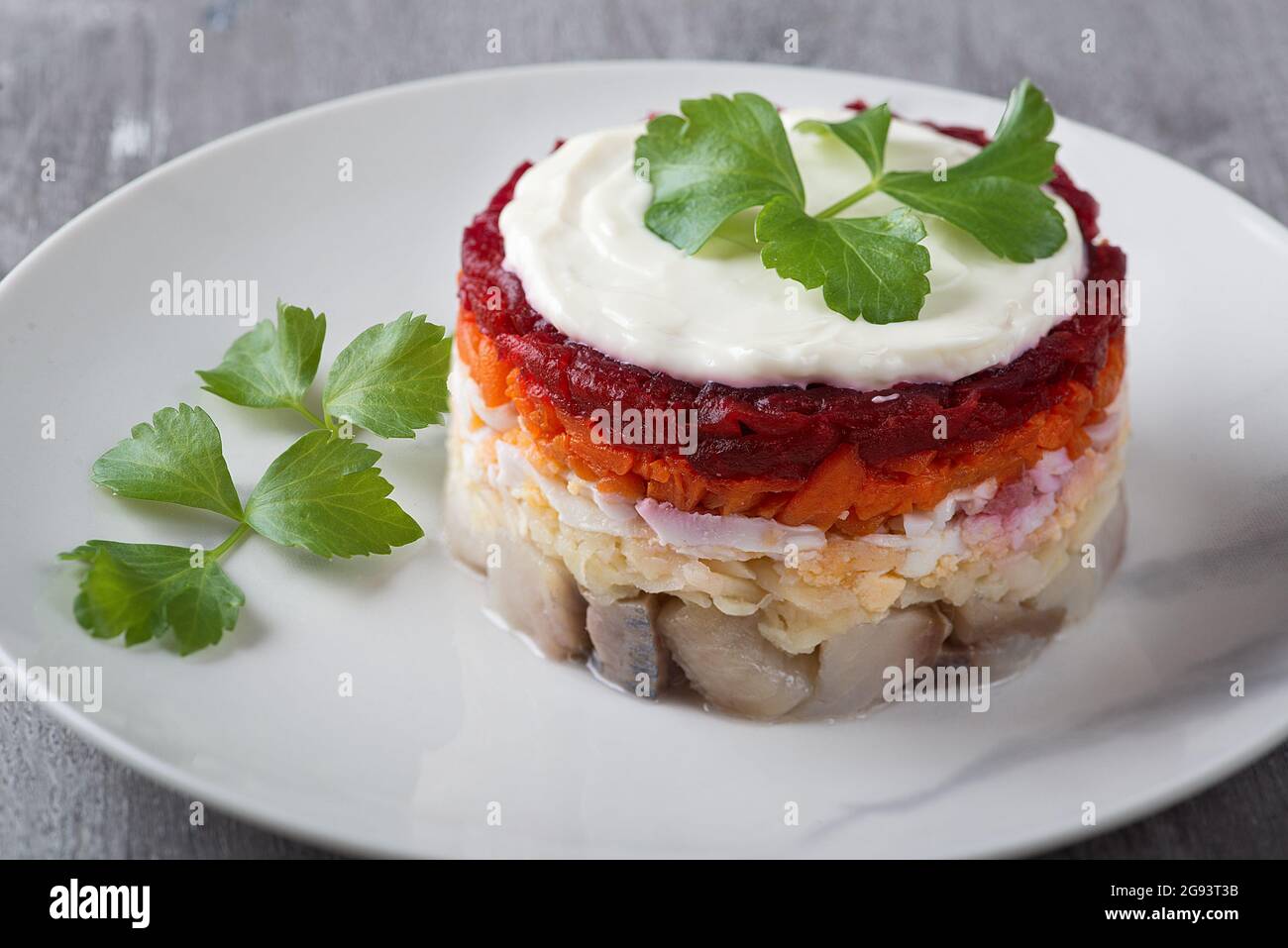 Traditional Russian salad herring under a fur coat, vintage wood
