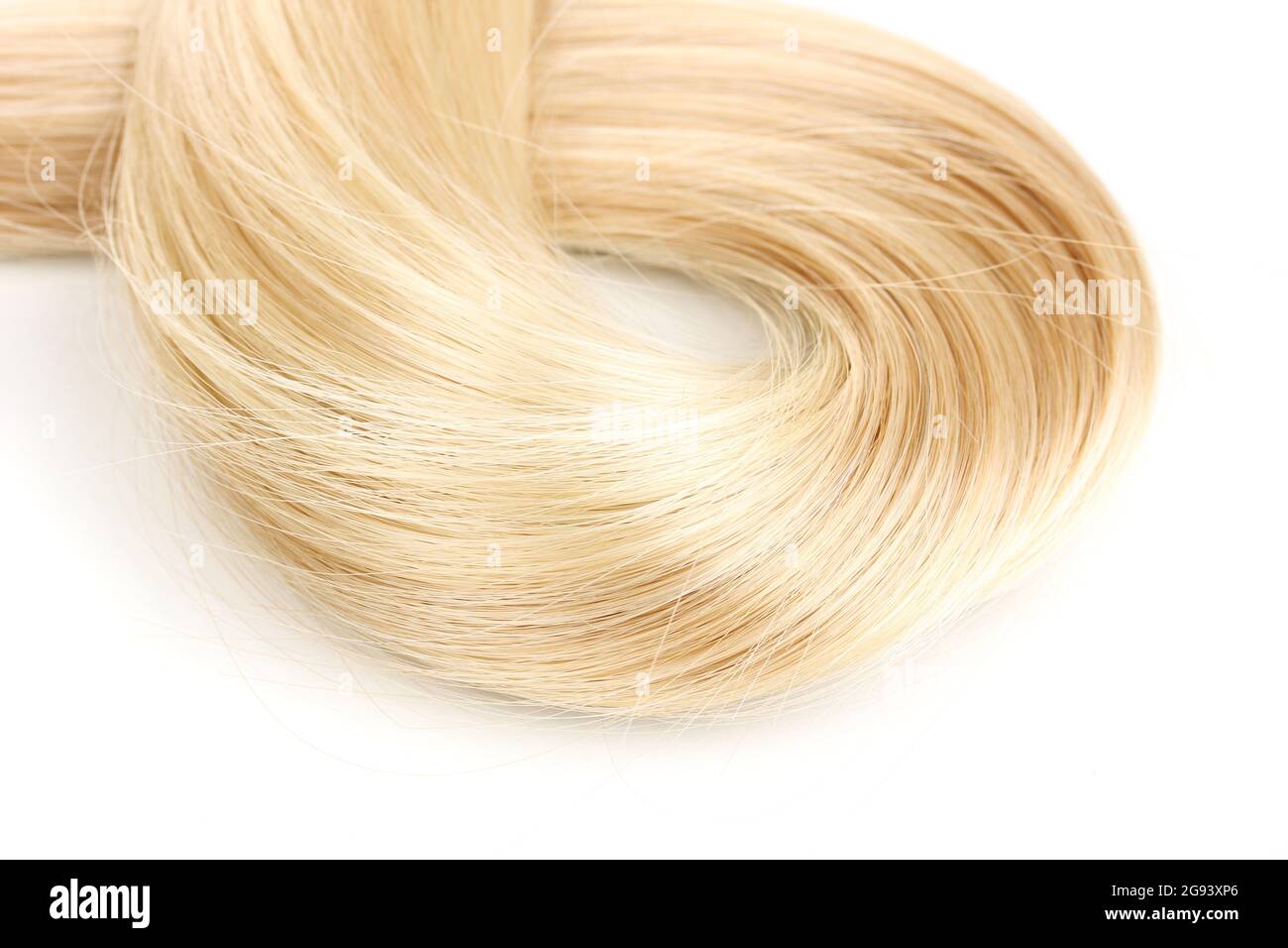 Shiny blond hair isollated on white Stock Photo - Alamy