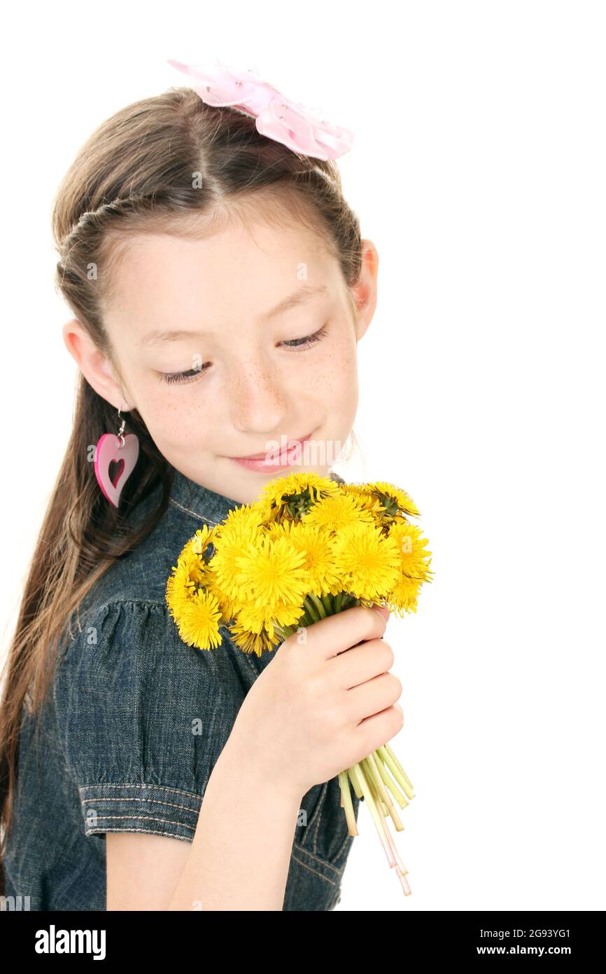 Portrait of beautiful little girl with dandelions isolated on white ...