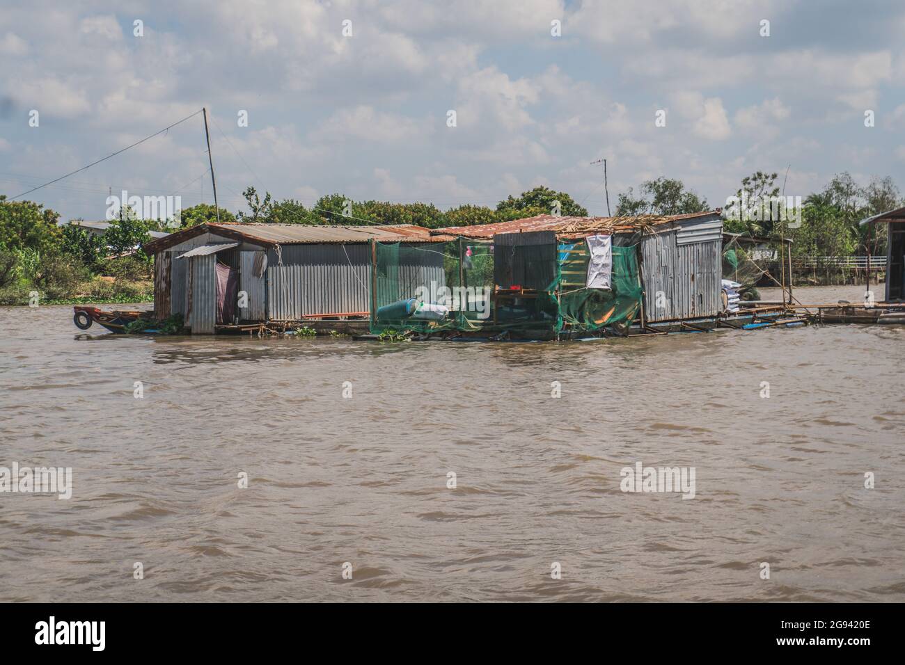 Floating house on the Mekong River in Vietnam, South East Asia. Vung