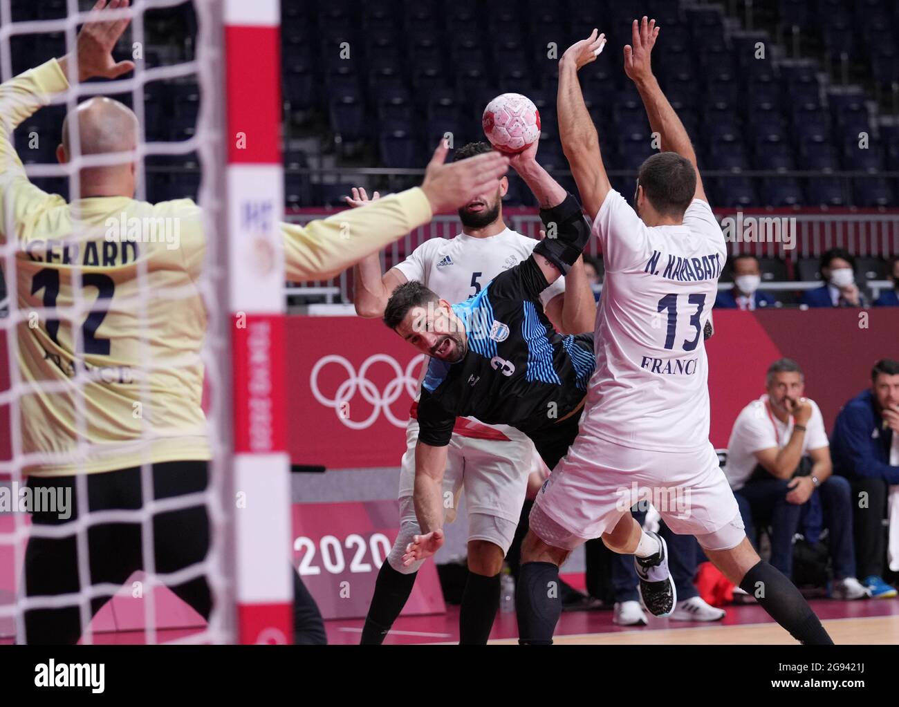 Tokyo, Japan. 24th July, 2021. Federico Pizarro (2nd R) of Argentina shoots during the men's handball preliminary round Group A match between France and Argentina in Tokyo, Japan, July 24, 2021. Credit: Meng Yongmin/Xinhua/Alamy Live News Stock Photo