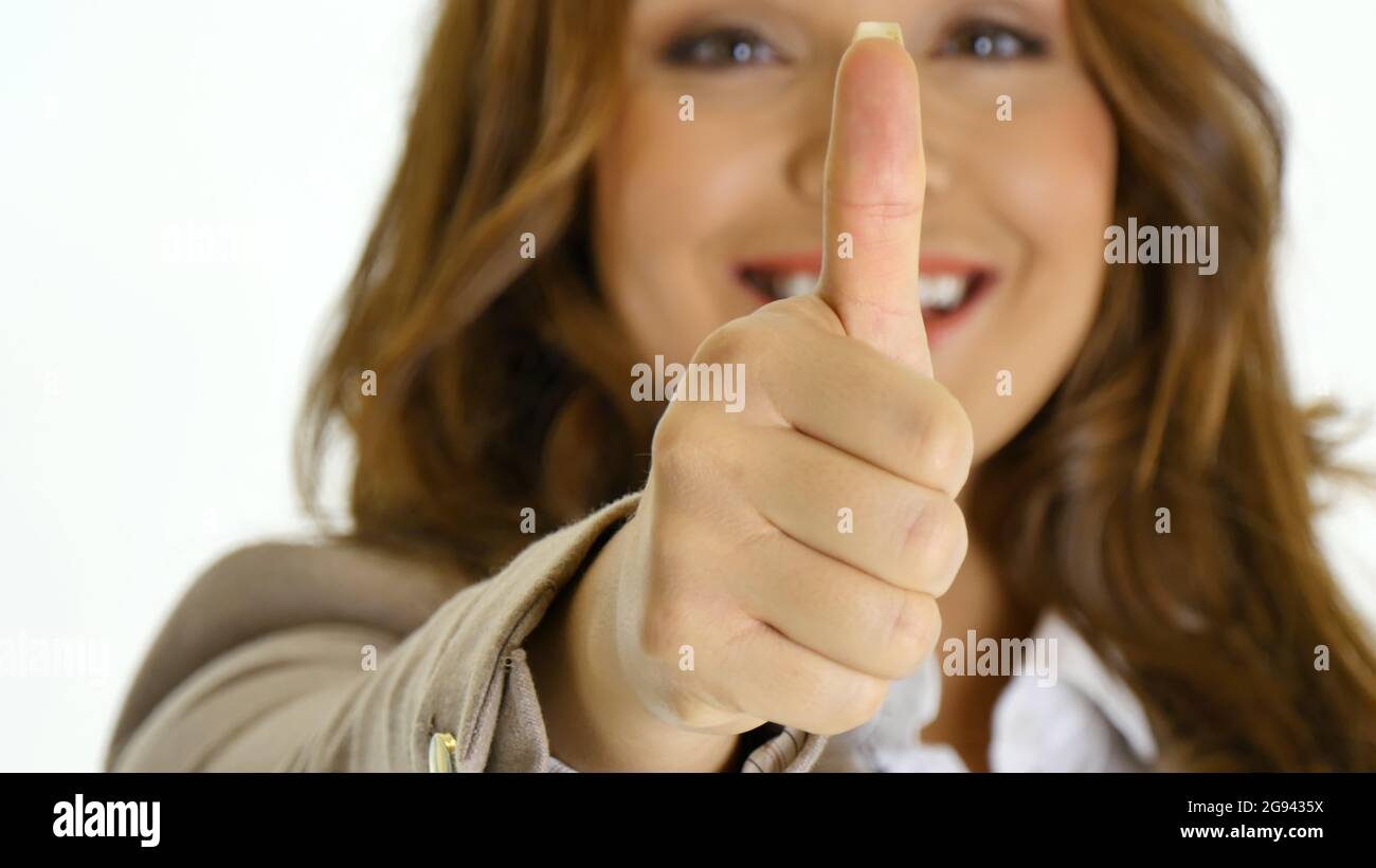 Happy businesswoman giving thumbs up. Isolated on white background Stock Photo