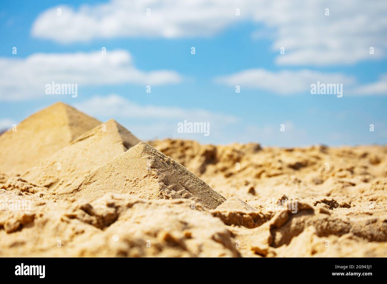 Miniature pyramids in desert made of sand on beach Stock Photo - Alamy