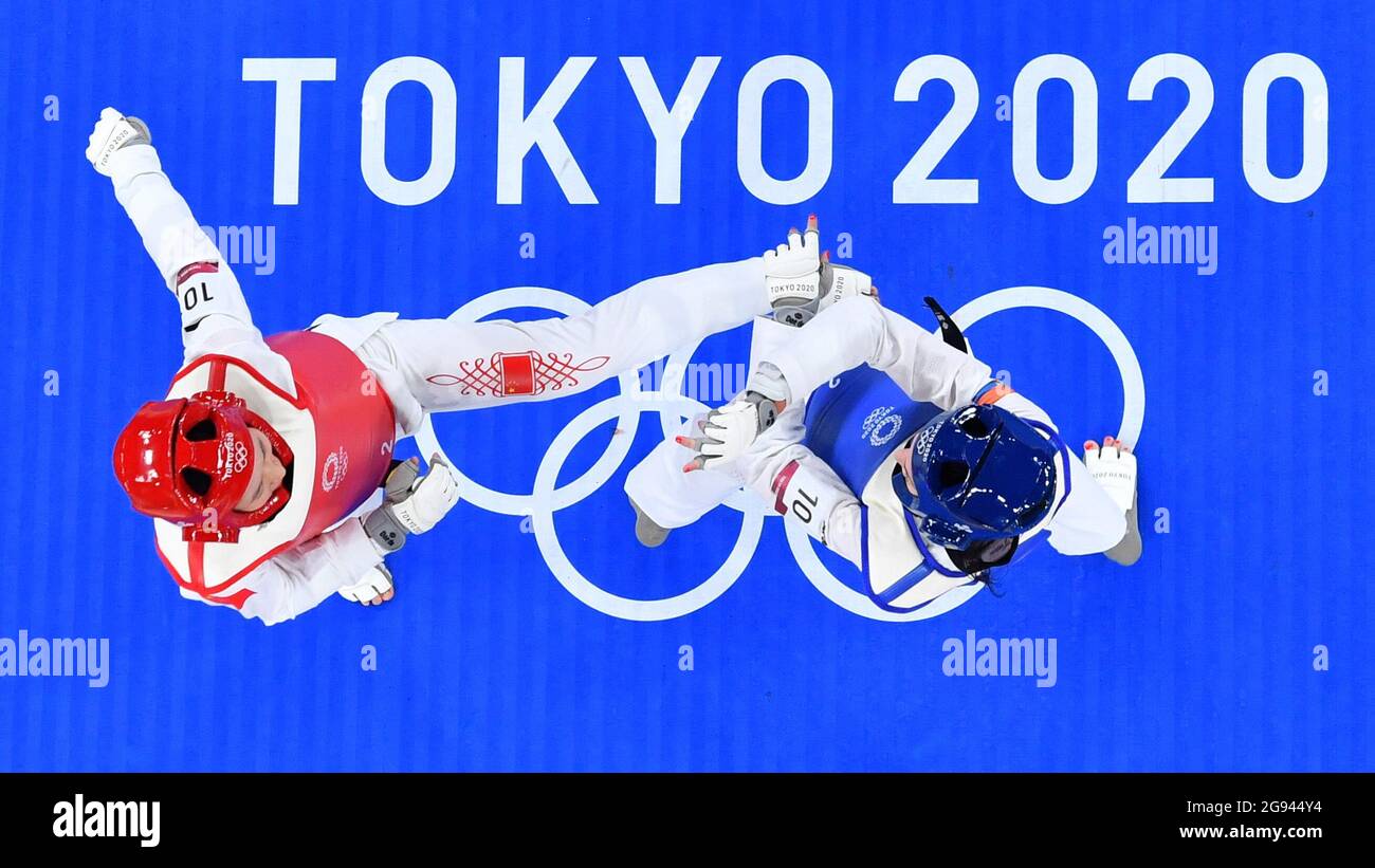 Tokyo, Japan. 24th July, 2021. Wu Jingyu (L) of China competes with Tijana Bogdanovic of Serbia during the women's 49kg taekwondo repechage match at the Tokyo 2020 Olympic Games in Tokyo, Japan, July 24, 2021. Credit: Xu Zijian/Xinhua/Alamy Live News Stock Photo