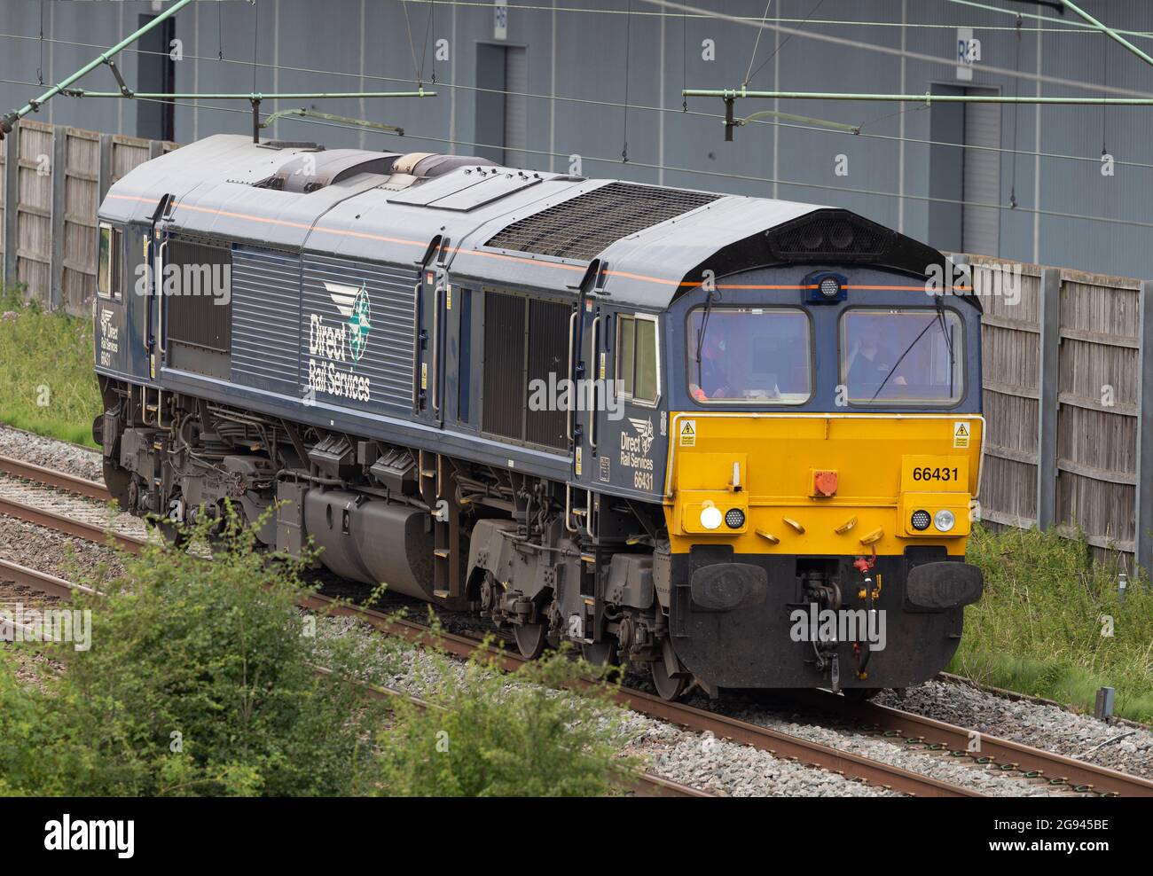 Direct Rail Services Class 66 - 66431 running light past DIRFT Stock Photo