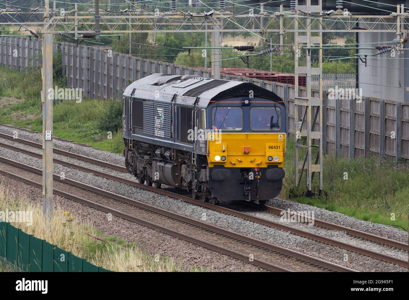 Direct Rail Services Class 66 - 66431 running light past DIRFT Stock Photo