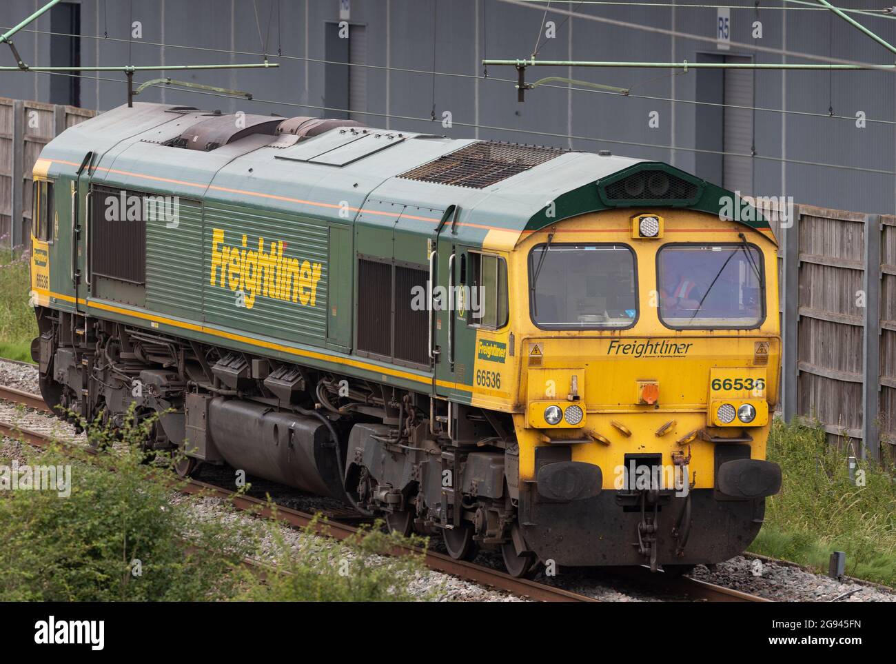 Freightliner Class 66 - 66536, running light past DIRFT Stock Photo