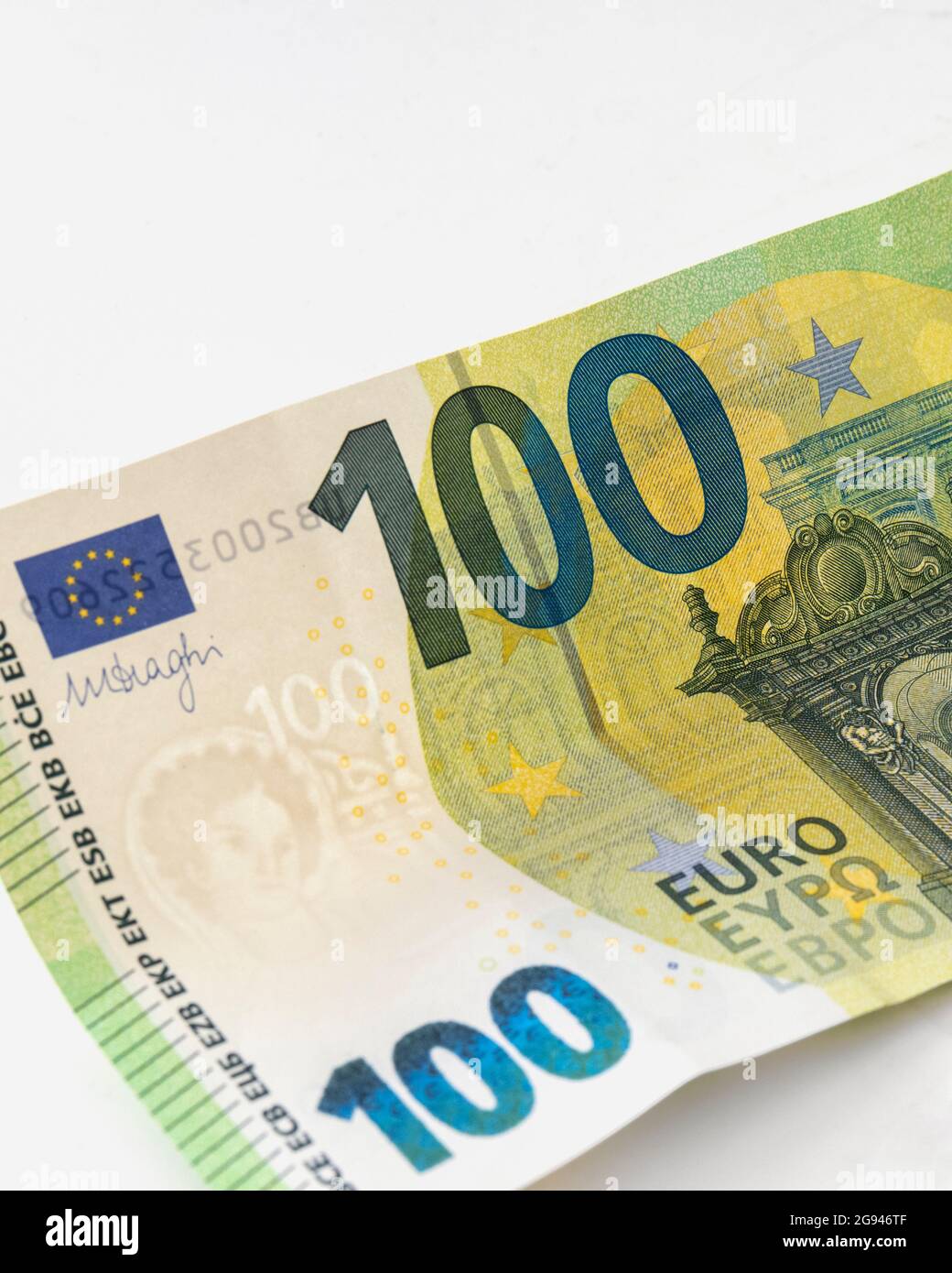 Detail of 100 Euro banknote on white background. Stock Photo