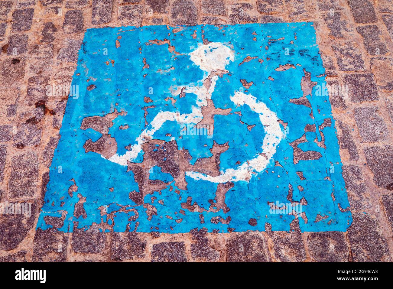 Parking space reserved for disabled drivers or drivers carrying disabled passengers. Stock Photo