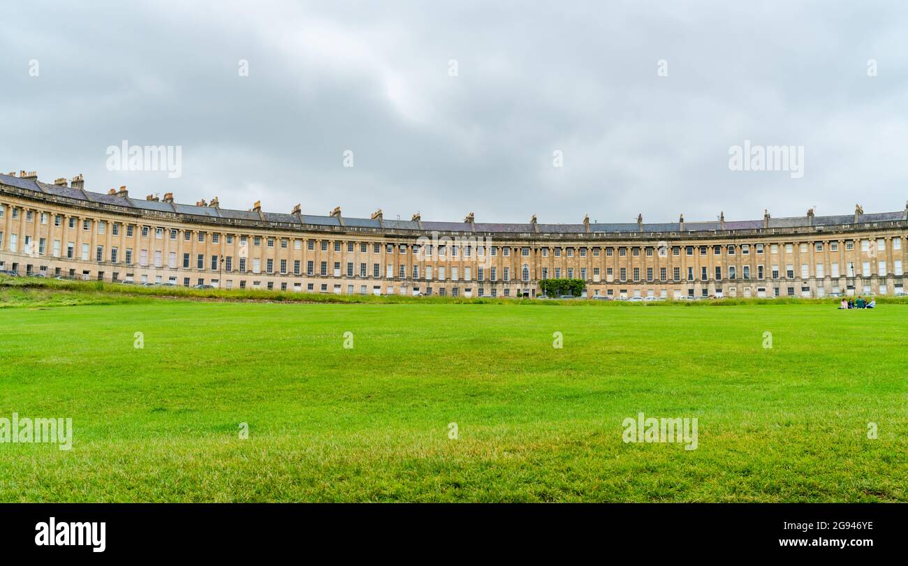 BATH, UK - JUNE 27, 2021: Panoramic view of Royal Crescent in Bath, overlooking Royal Victoria Park. Stock Photo