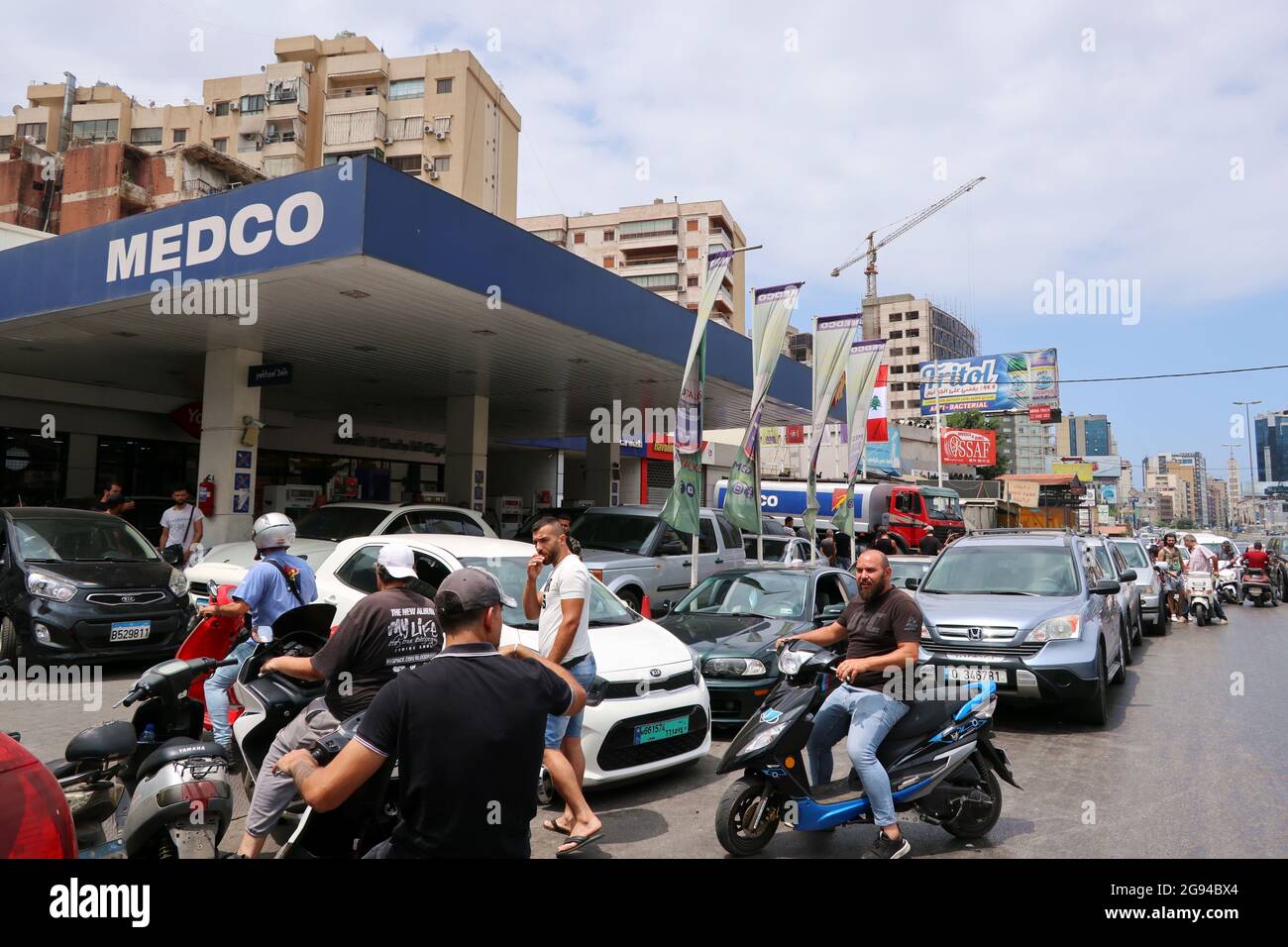 Beirut, Lebanon. 23rd July, 2021. Clients queue at a petrol station in