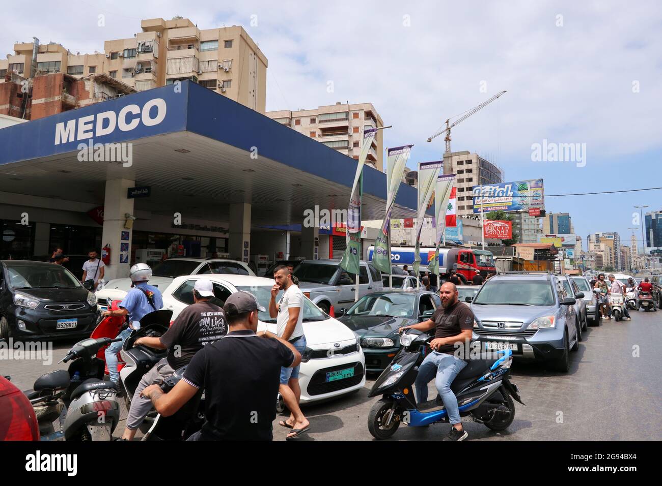 Beirut, Lebanon. 23rd July, 2021. Clients queue at a petrol station in Beirut, Lebanon, on July 23, 2021.Due to the lack of fuel, petrol stations in Lebanon currently can't serve the needs of all customers and people use to sleep at night in their cars waiting for the opening of stations. According the newspaper L'orient le jour, in the night between July 23 and 24 a truck hit some cars queueing at a petrol station in Beirut, killing a person and injurying three others. (Photo by Elisa Gestri/Sipa USA) Credit: Sipa USA/Alamy Live News Stock Photo