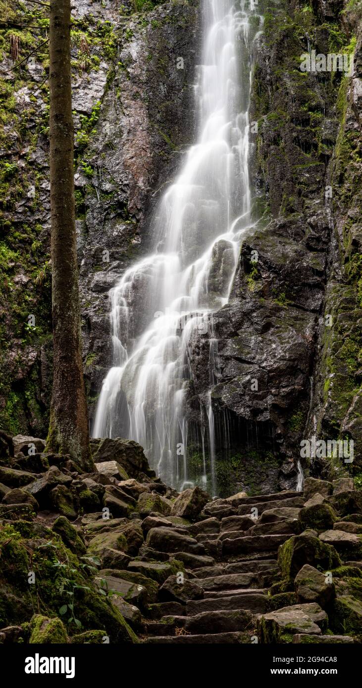 Vertical shot of The Burgbach Waterfall in the Black Forest in Bad Rippoldsau-Schapbach, Germany Stock Photo