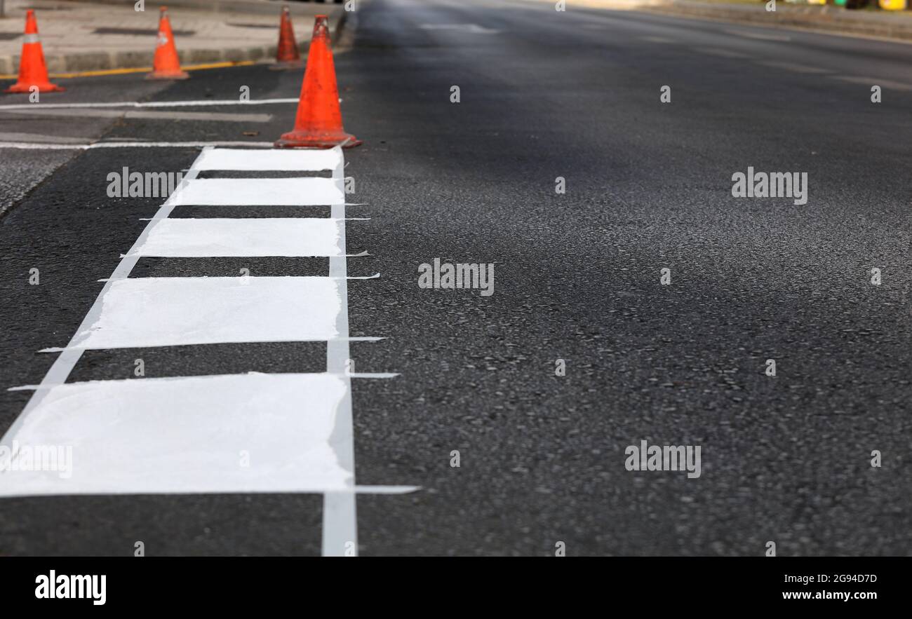 thermoplastic road marking tape, painting traffic lines and bike lanes on asphalt road surface