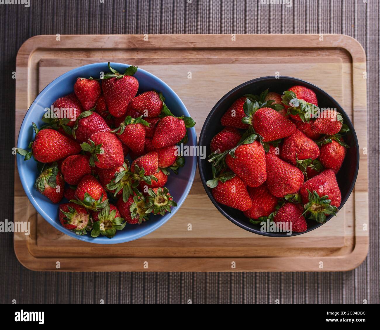 Strawberries in a plate on a table ready to prepare Stock Photo Alamy