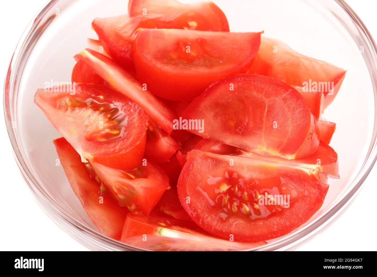Diced tomatoes in glass bowl isolated on white Stock Photo Alamy