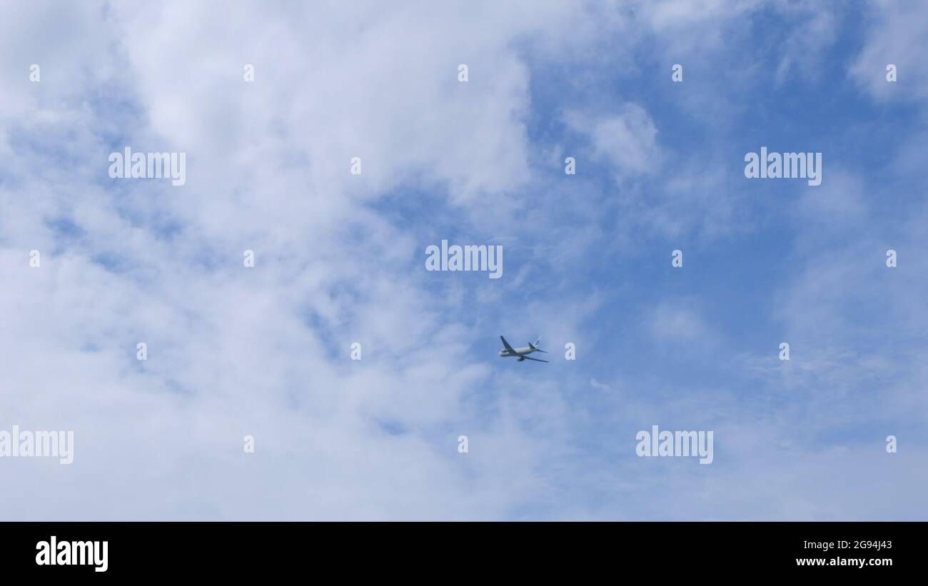 Silhouette Modern large plane flies in the sky. Beautiful blue sky and ...