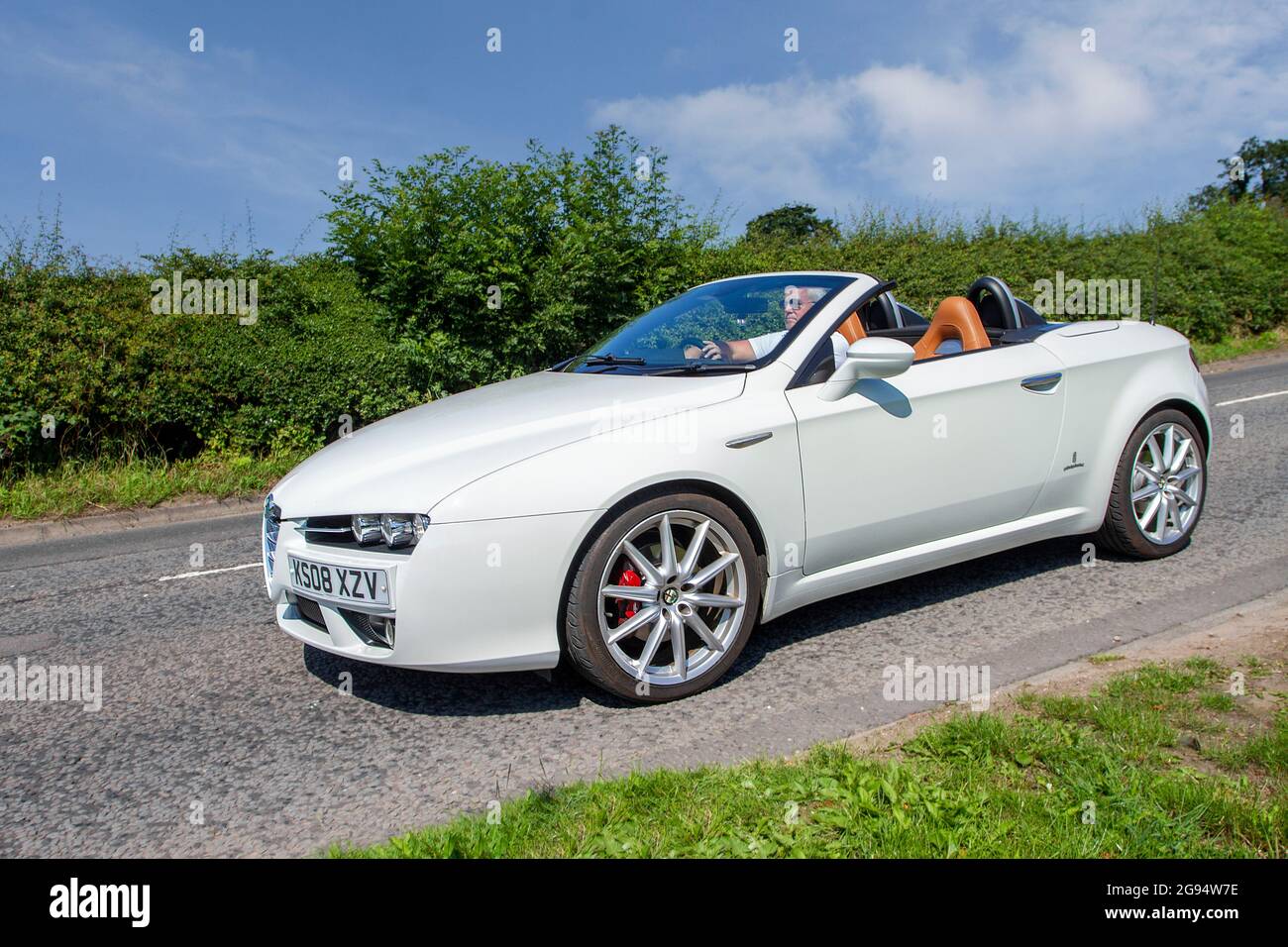 2008 white Alfa Romeo Spider Jts Le 2198cc Italian roadster cabrio en-route to Capesthorne Hall classic July car show, Cheshire, UK Stock Photo